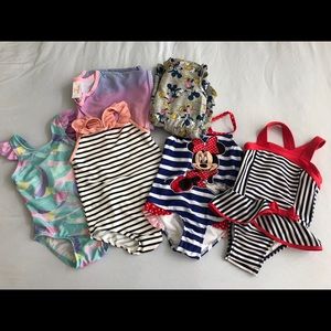 Lot of 4 toddler girl swimsuits and 2 coverups.